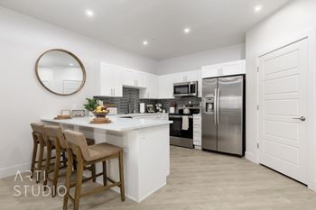 Modern kitchen with island and bar stools